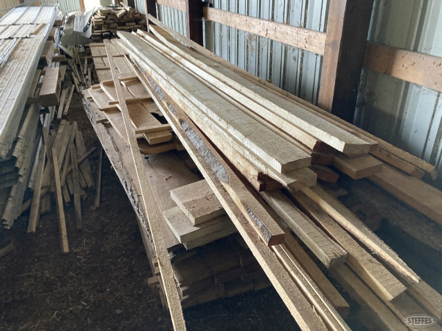 (4) Piles of home sawed lumber